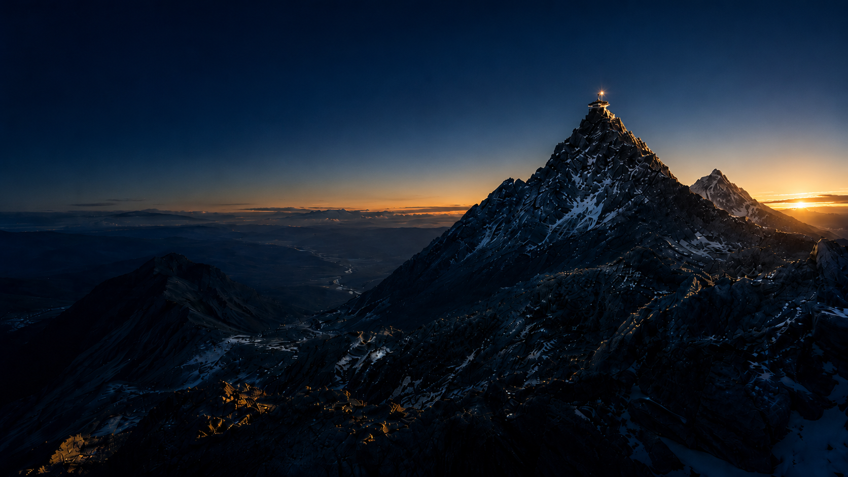 First light striking an engineered summit at dawn